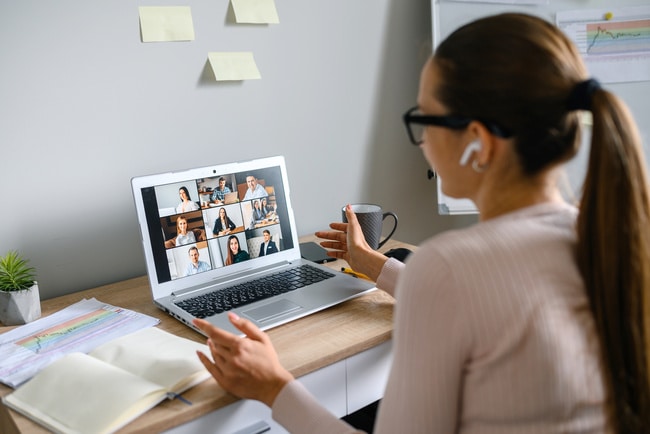 Businesswoman in a virtual meeting with clients.